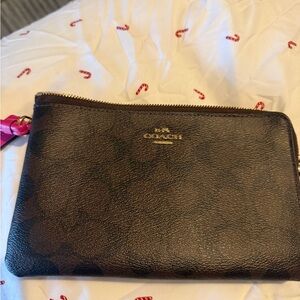Coach large Dark Brown Wristlet with Pink Accent